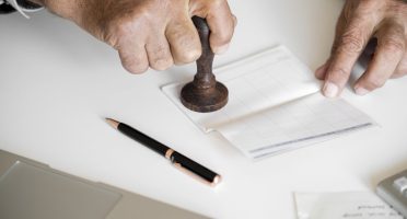 People checking bankbook isolated on white table