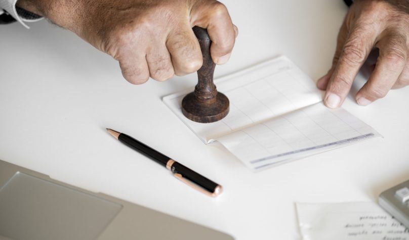 People checking bankbook isolated on white table