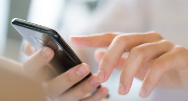 Business hand with mobile phone